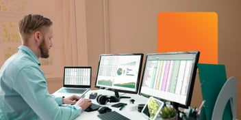 IT professional managing service data across multiple spreadsheets on dual monitors